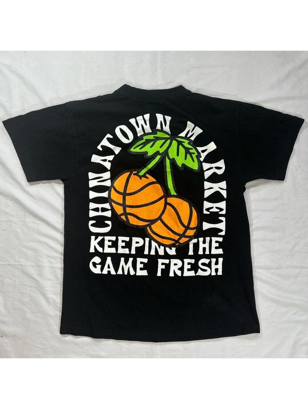 Chinatown Market Basketball Cherries graphic t shirt in black.